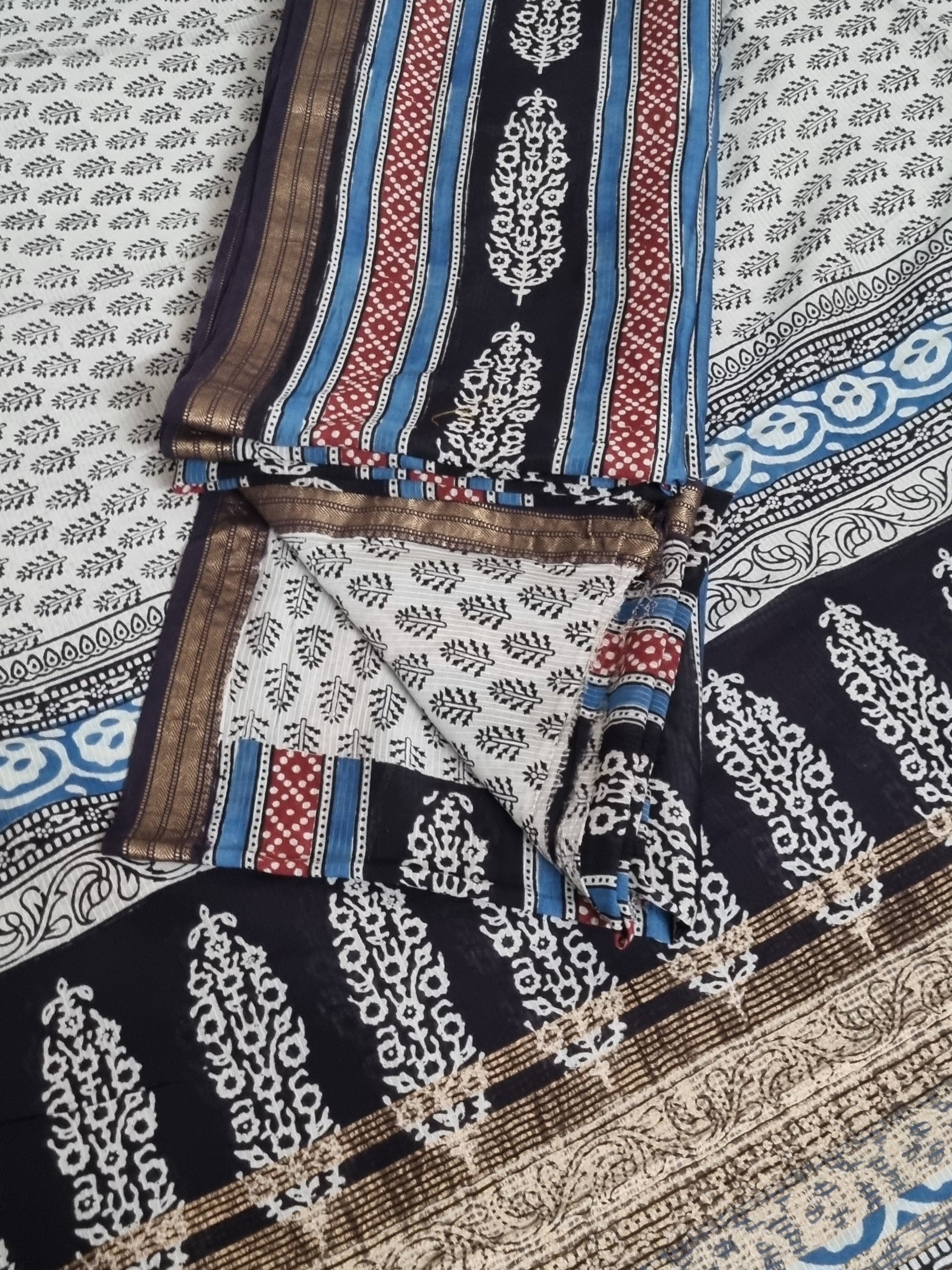 Close-up of Bagh hand block printed Maheshwari silk fabric in black and blue tones