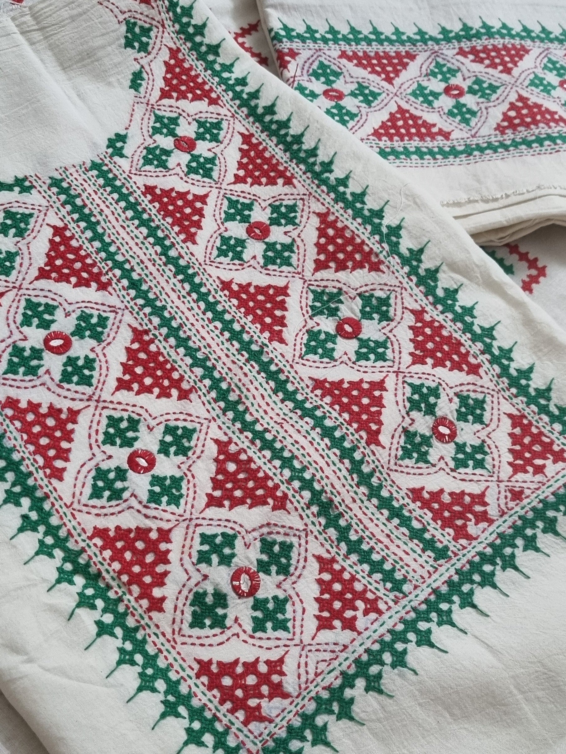 Cream cotton unstitched salwar suit with red green Sindhi embroidery – flat lay