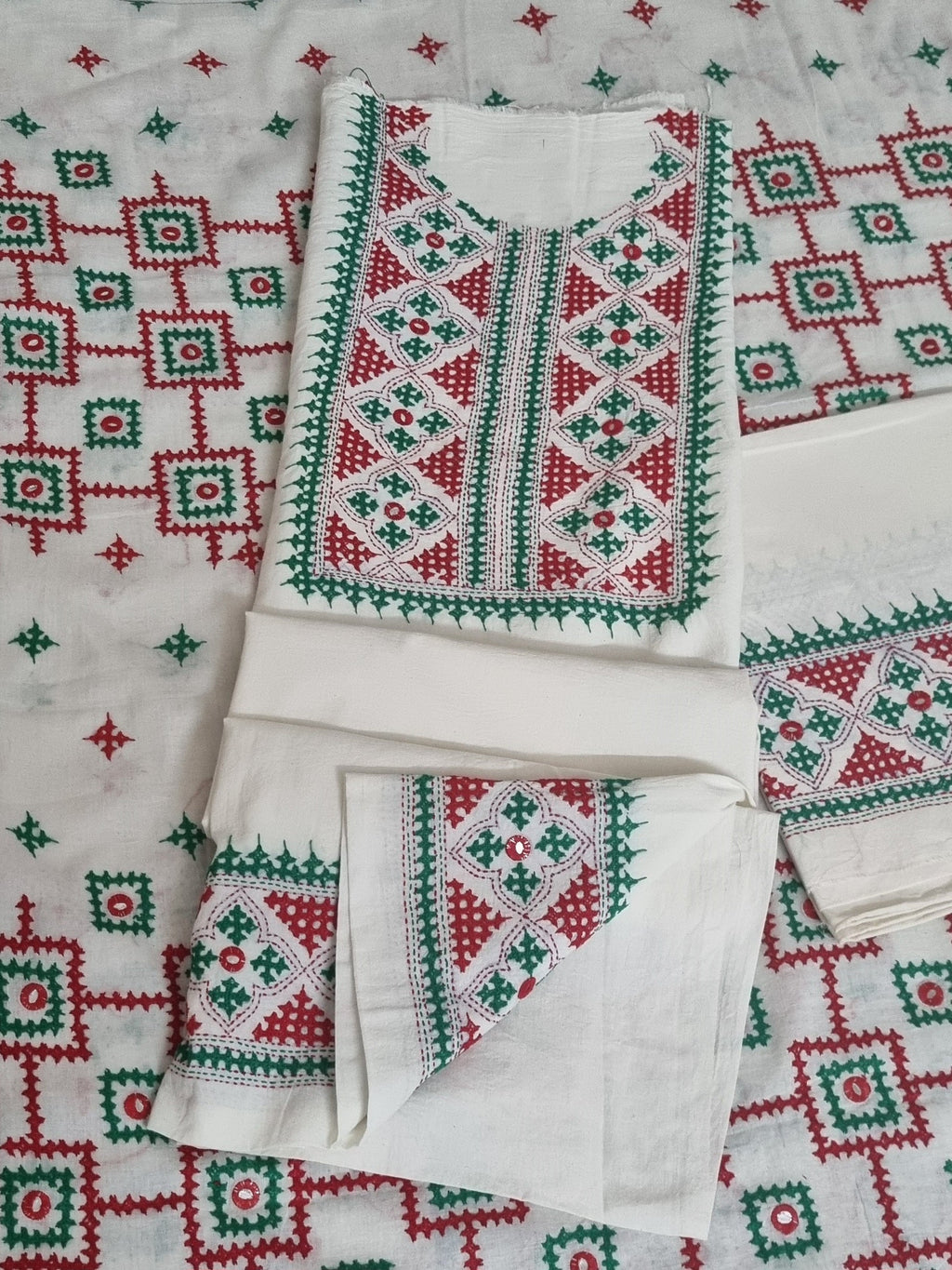 3-piece cream Sindhi embroidered unstitched suit in red and green – fabric detail