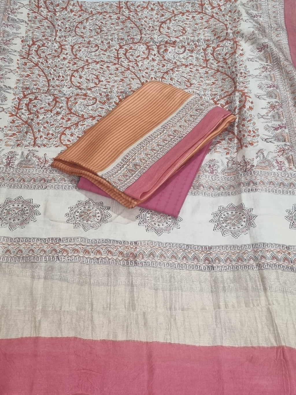 Orange Maheshwari silk kurta fabric with beige block print – close-up detail