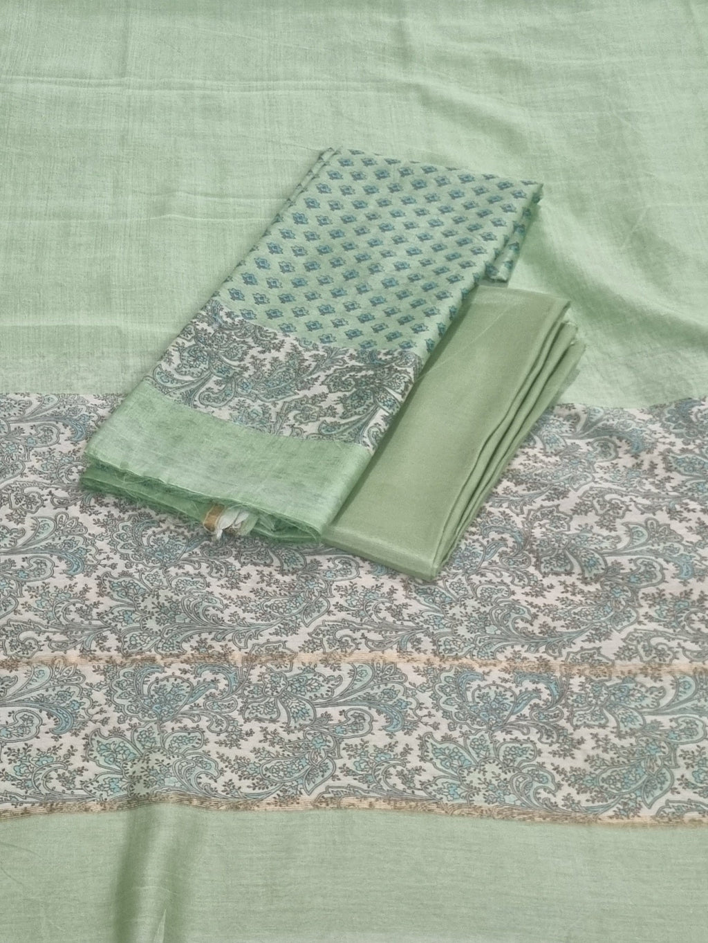 Blue and green Chanderi silk unstitched suit set with Booti print – styled flat lay
