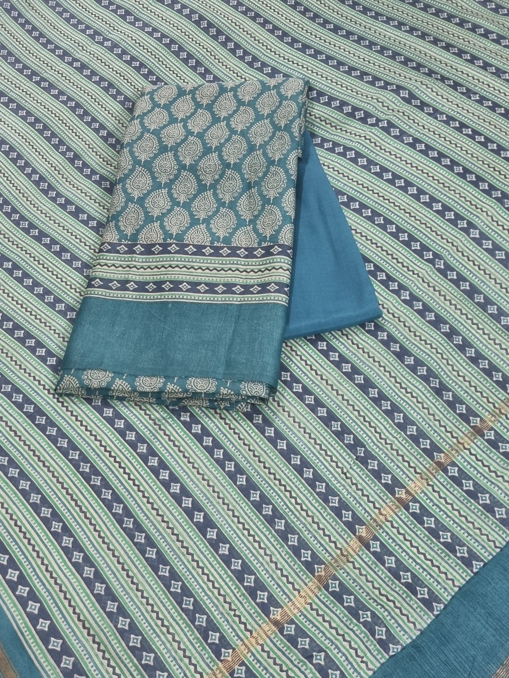 Blue and green Chanderi silk unstitched suit set with printed booti – front flat lay
