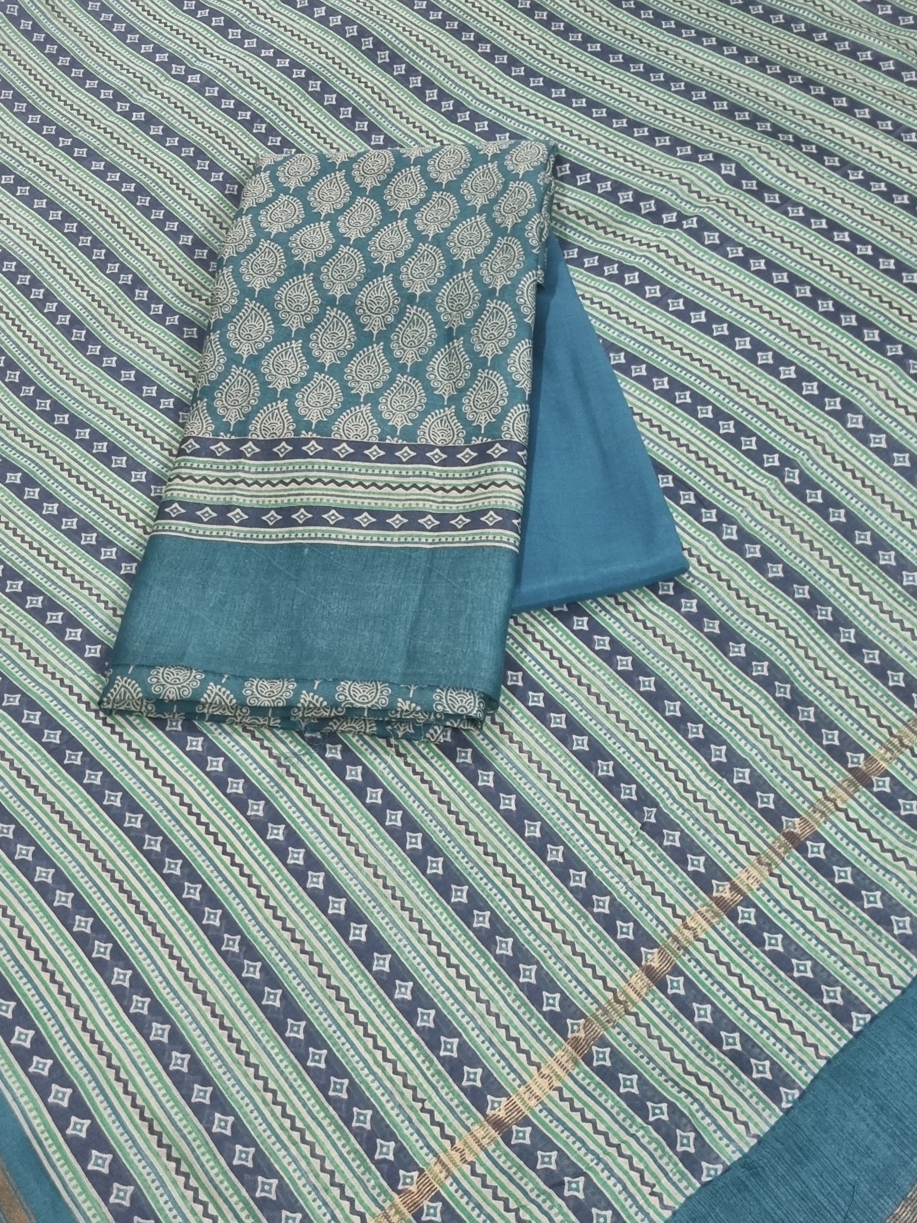 Blue and green Chanderi silk unstitched suit set with printed booti – front flat lay