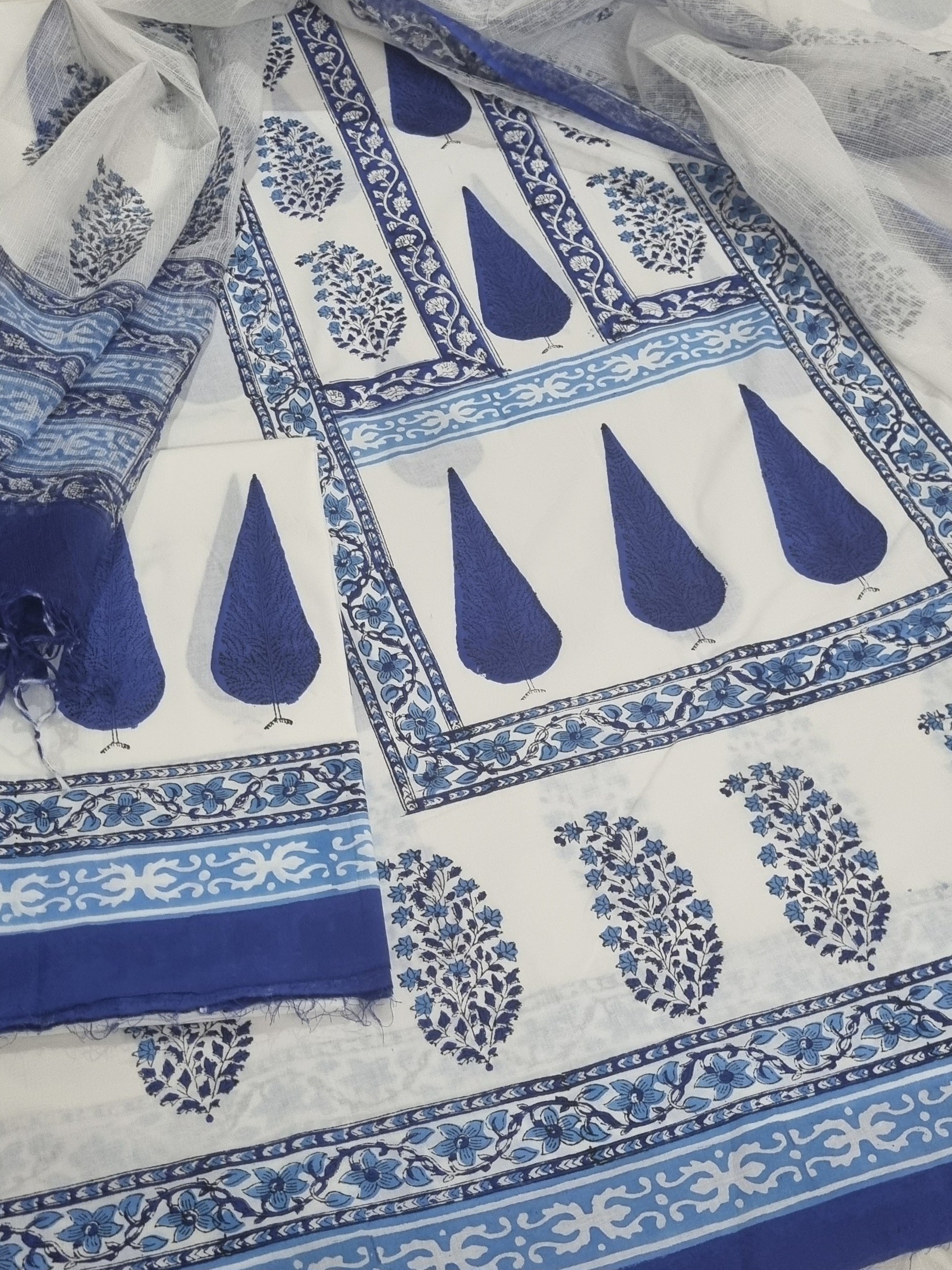 White and blue placement block print cotton unstitched suit with Kota Doria dupatta – front flat lay