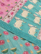 Close-up of Pichwai Print Banarasi Semi Tussar Fabric in Peacock Blue-Green | Tantuvanacrafts