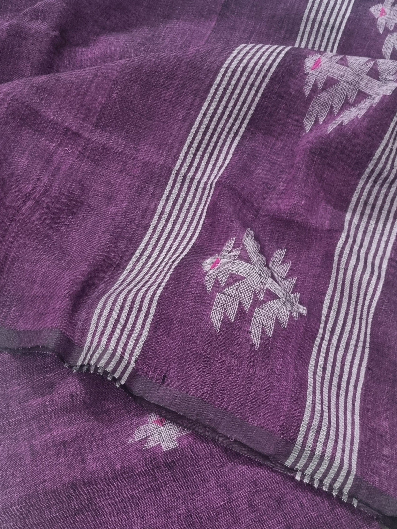60 Lea linen unstitched suit material in deep purple – close-up of all-over woven motifs, pure Indian handloom