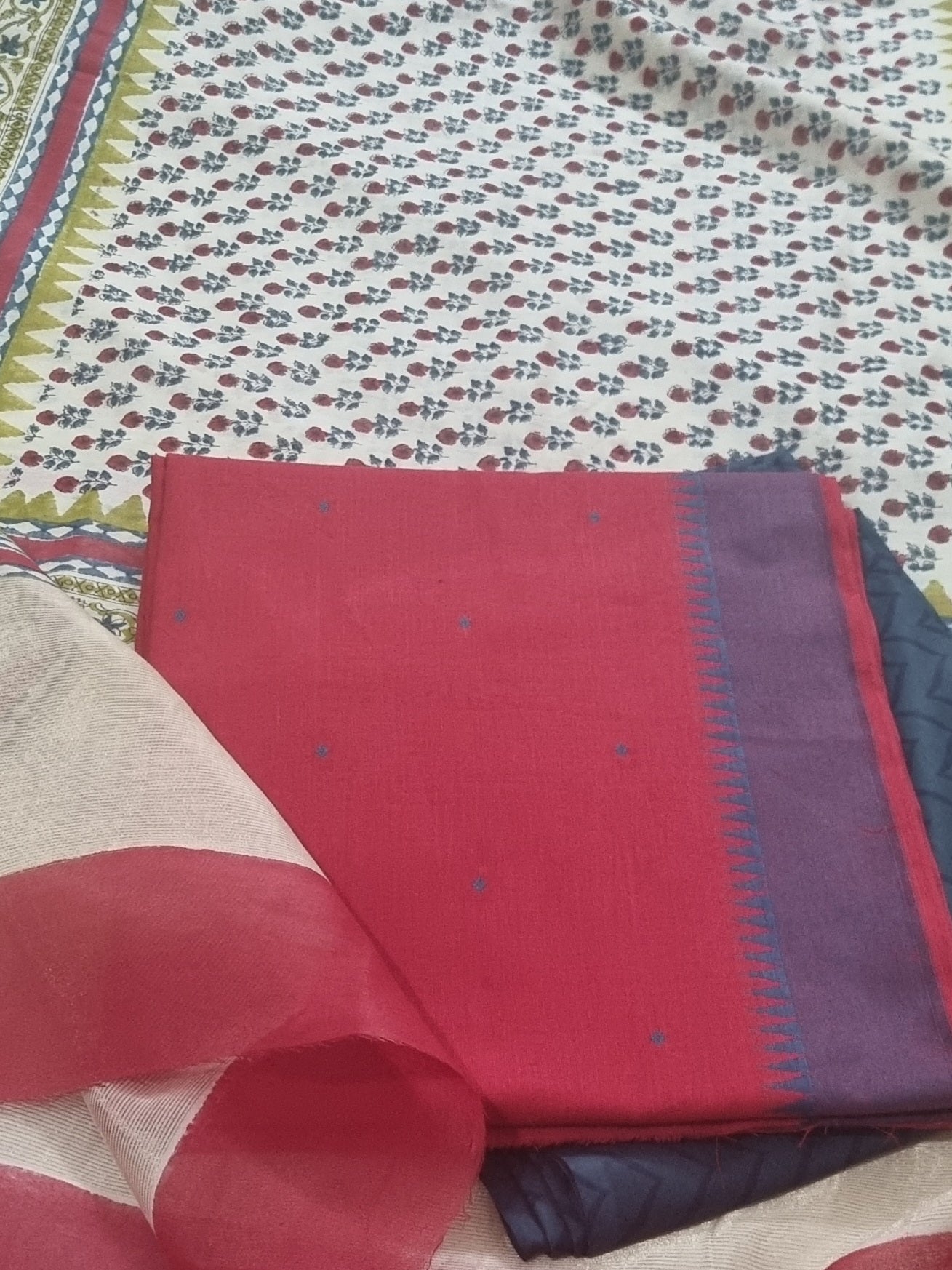 	Handwoven cotton unstitched suit fabric in red and blue – close-up texture