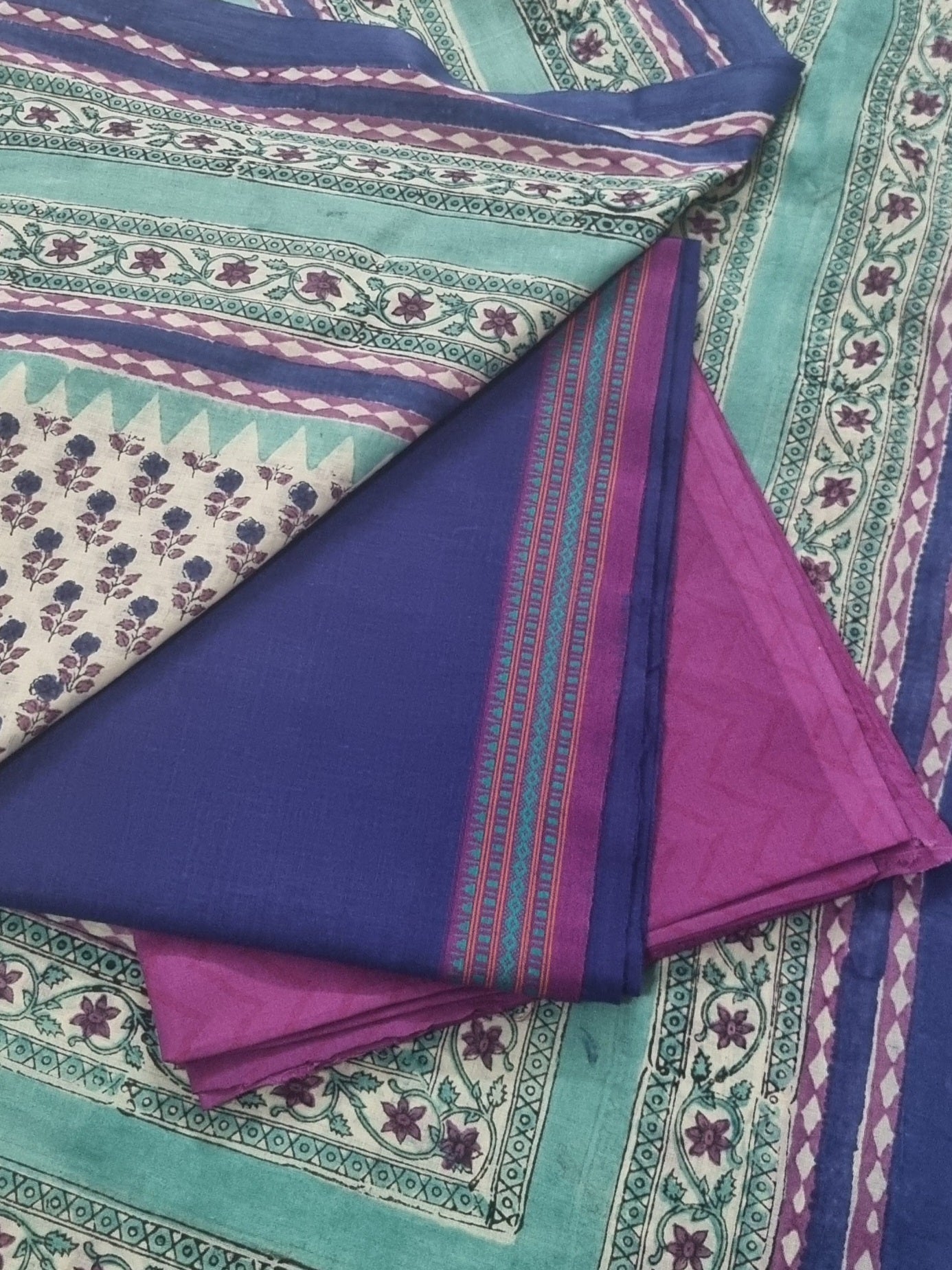 Handwoven cotton unstitched suit fabric in blue and purple – close-up texture
