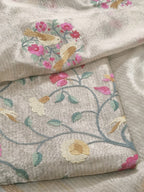 Close-up – handloom gold brocade fabric texture with intricate embroidery