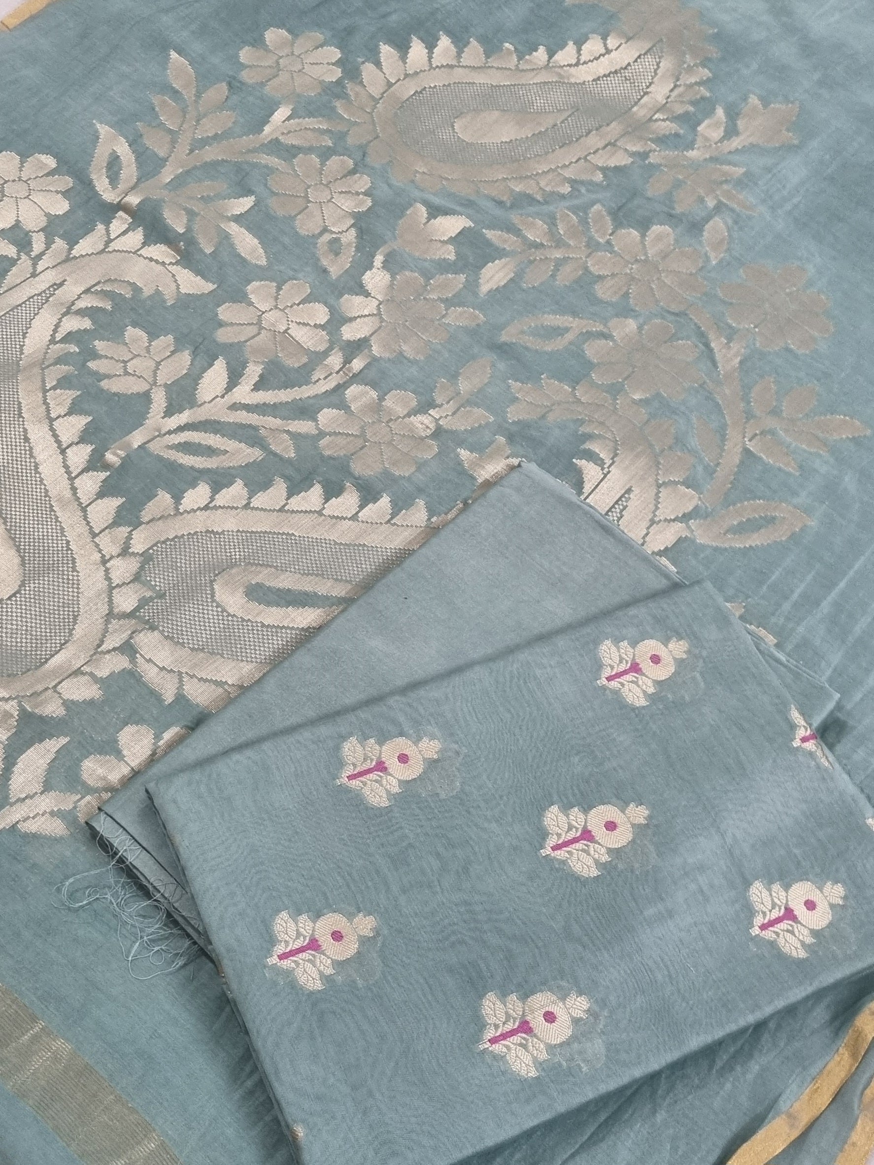Flat lay of sea green Banarasi unstitched suit set — Karwa Booti handwoven Indian handloom fabric