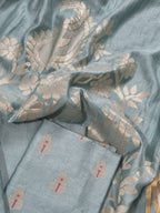 Close-up of Karwa Booti weave on sea green Banarasi unstitched suit — handwoven Indian textile