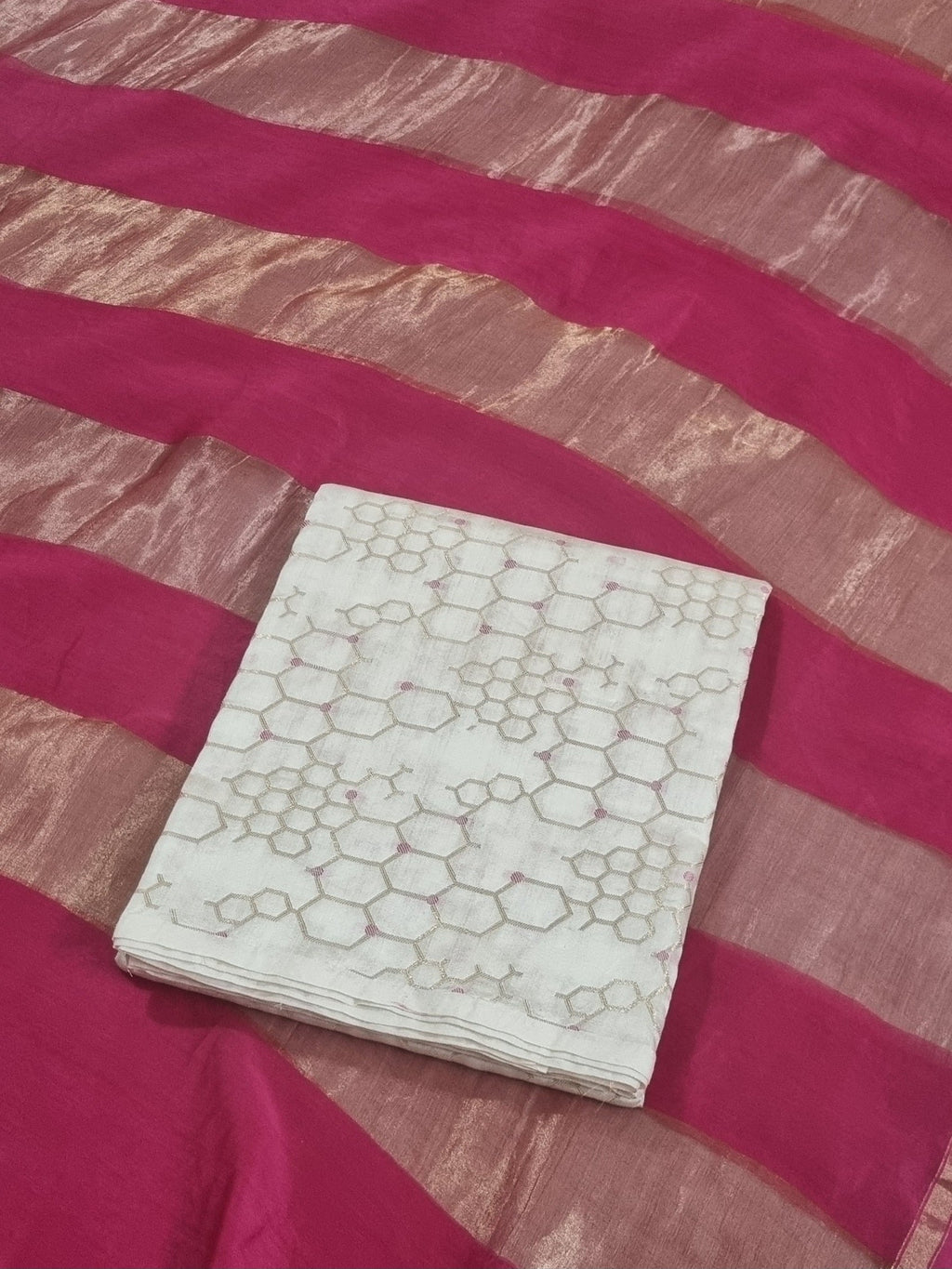Cream Banarasi unstitched suit fabric close-up — handwoven Indian handloom texture detail