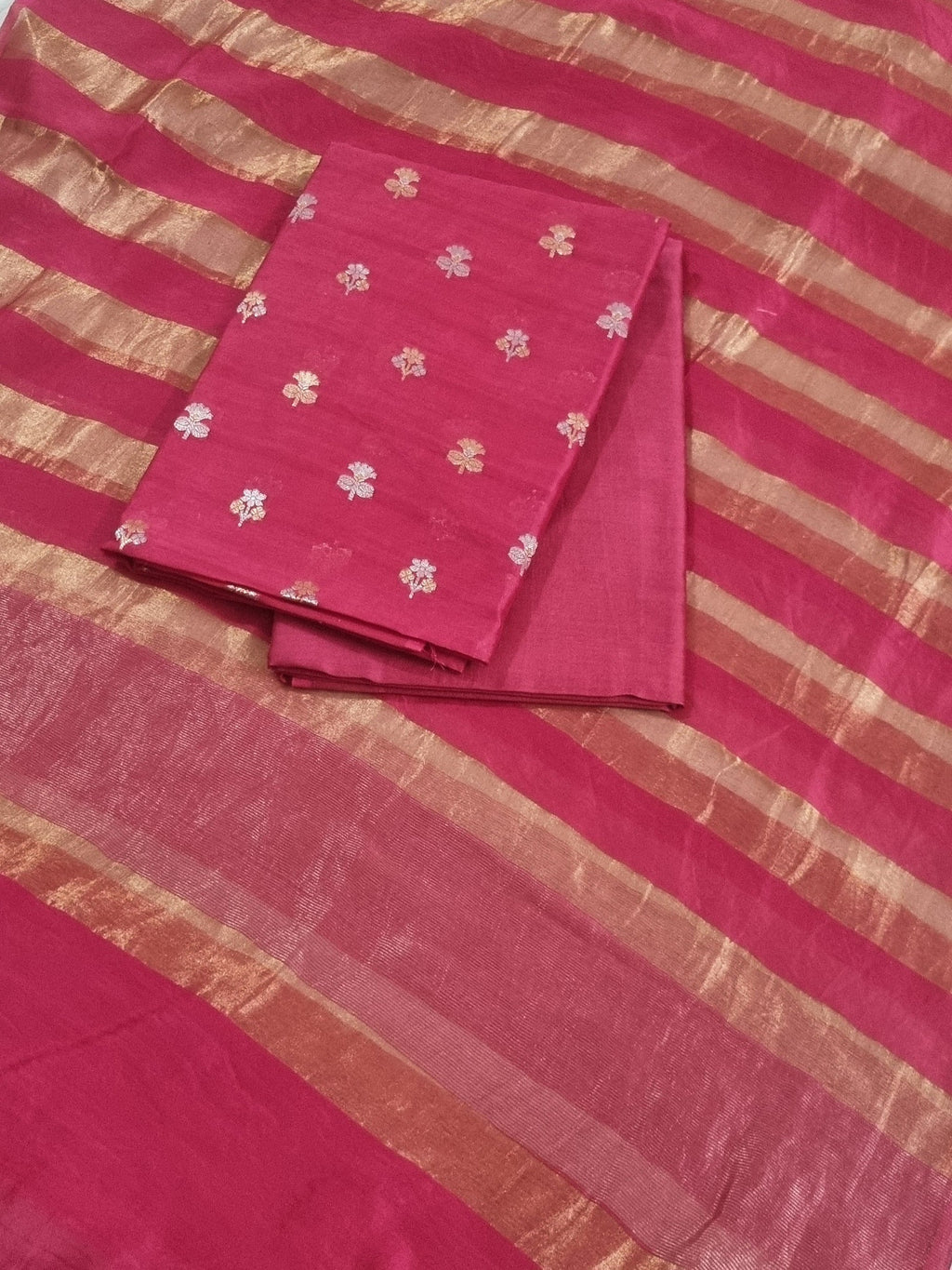 Flat lay of pink Banarasi unstitched suit set — Karwa Booti handwoven Indian handloom fabric