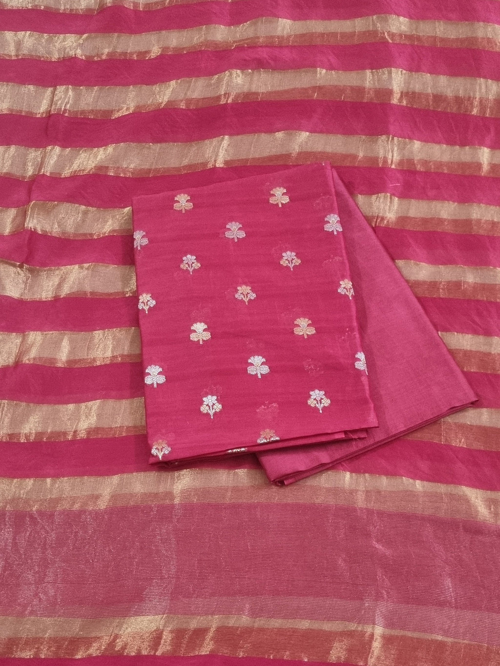 Close-up of Karwa Booti weave on pink Banarasi unstitched suit — handwoven Indian textile