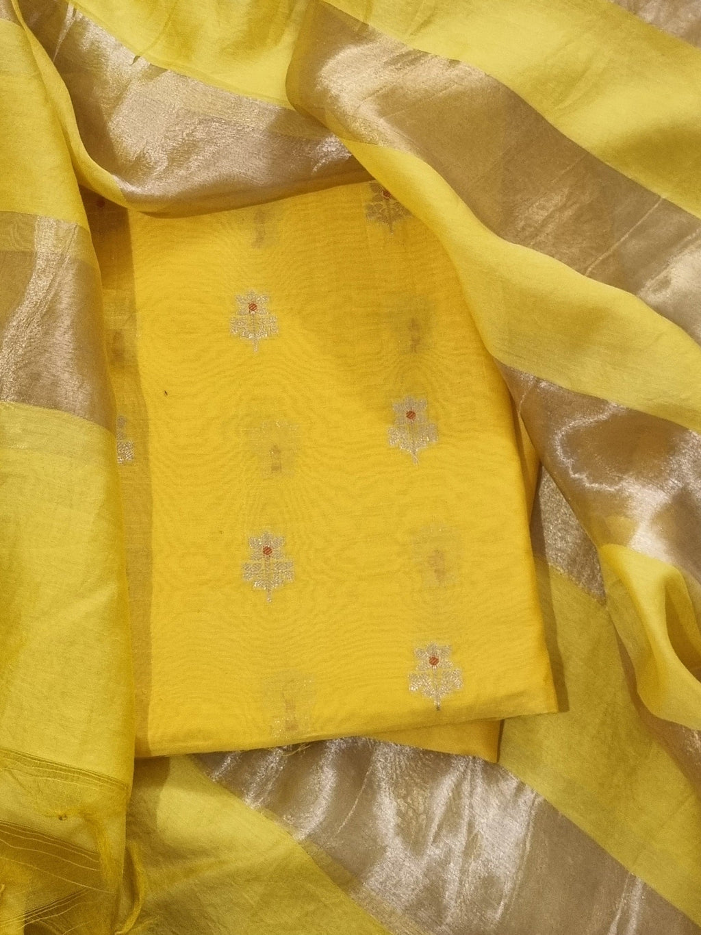 Handwoven yellow Banarasi Karwa Booti 3-piece unstitched suit — dupatta and fabric detail
