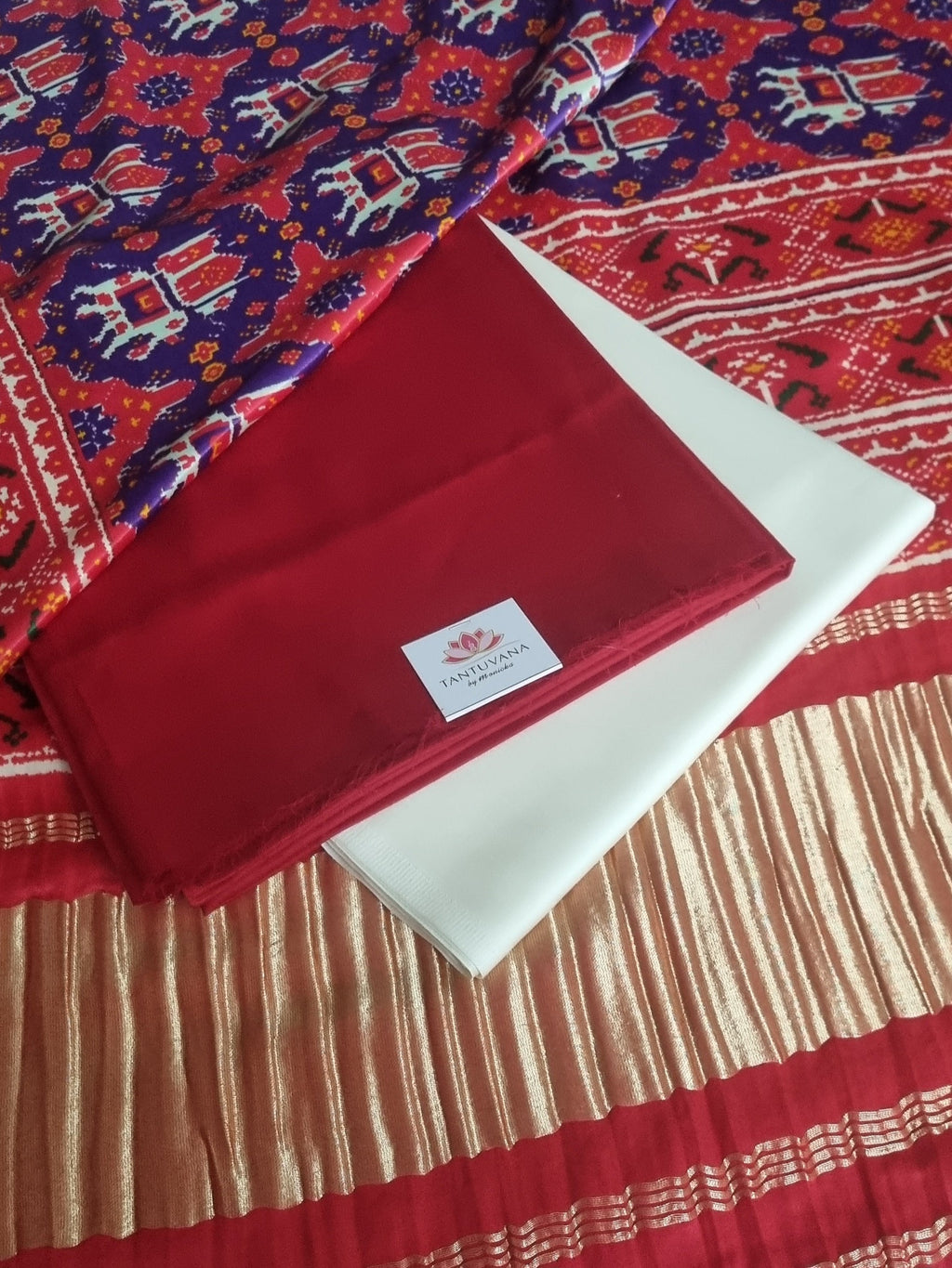 	Cotton silk 3-piece unstitched suit set in red and off white – styled look