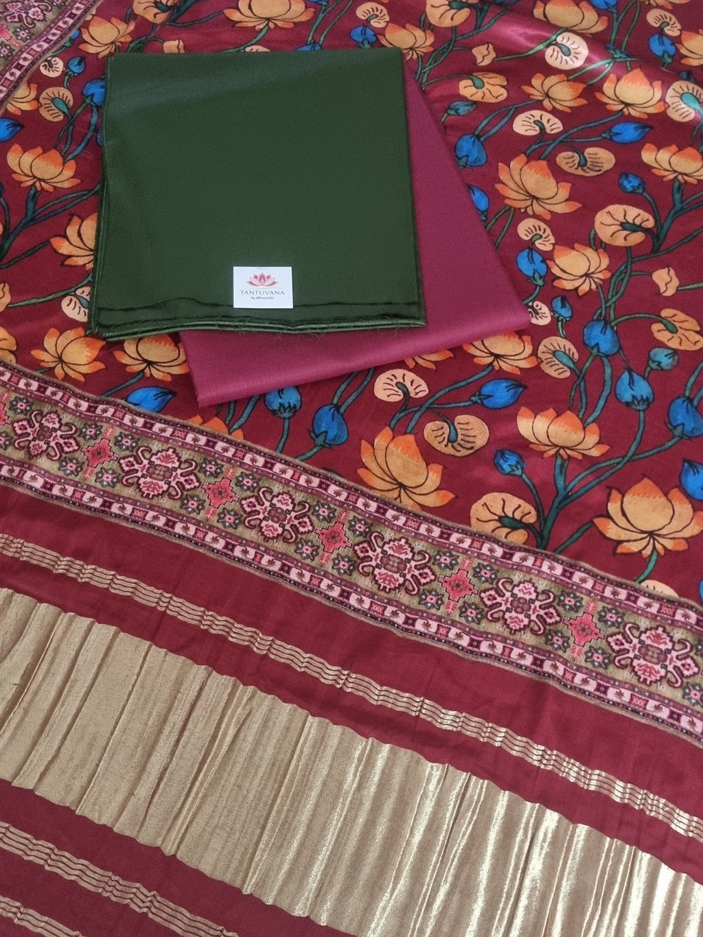 Green and maroon 3-piece unstitched suit set with Gajji Silk Kalamkari dupatta – flat lay