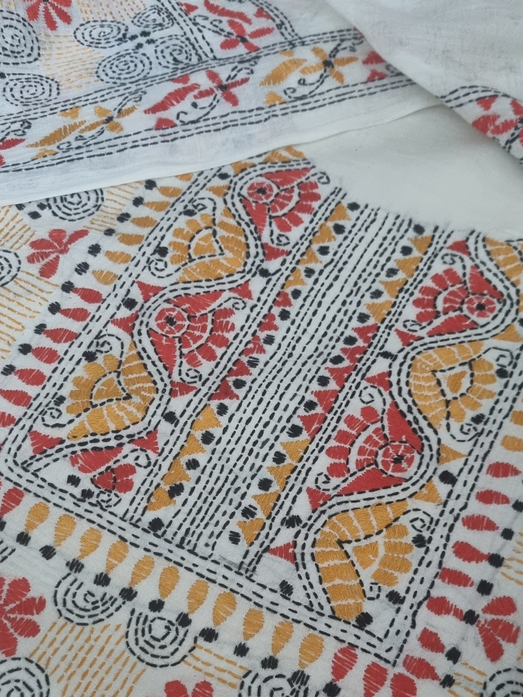 Cream cotton kurta with multicolour Kantha embroidery – editorial portrait view