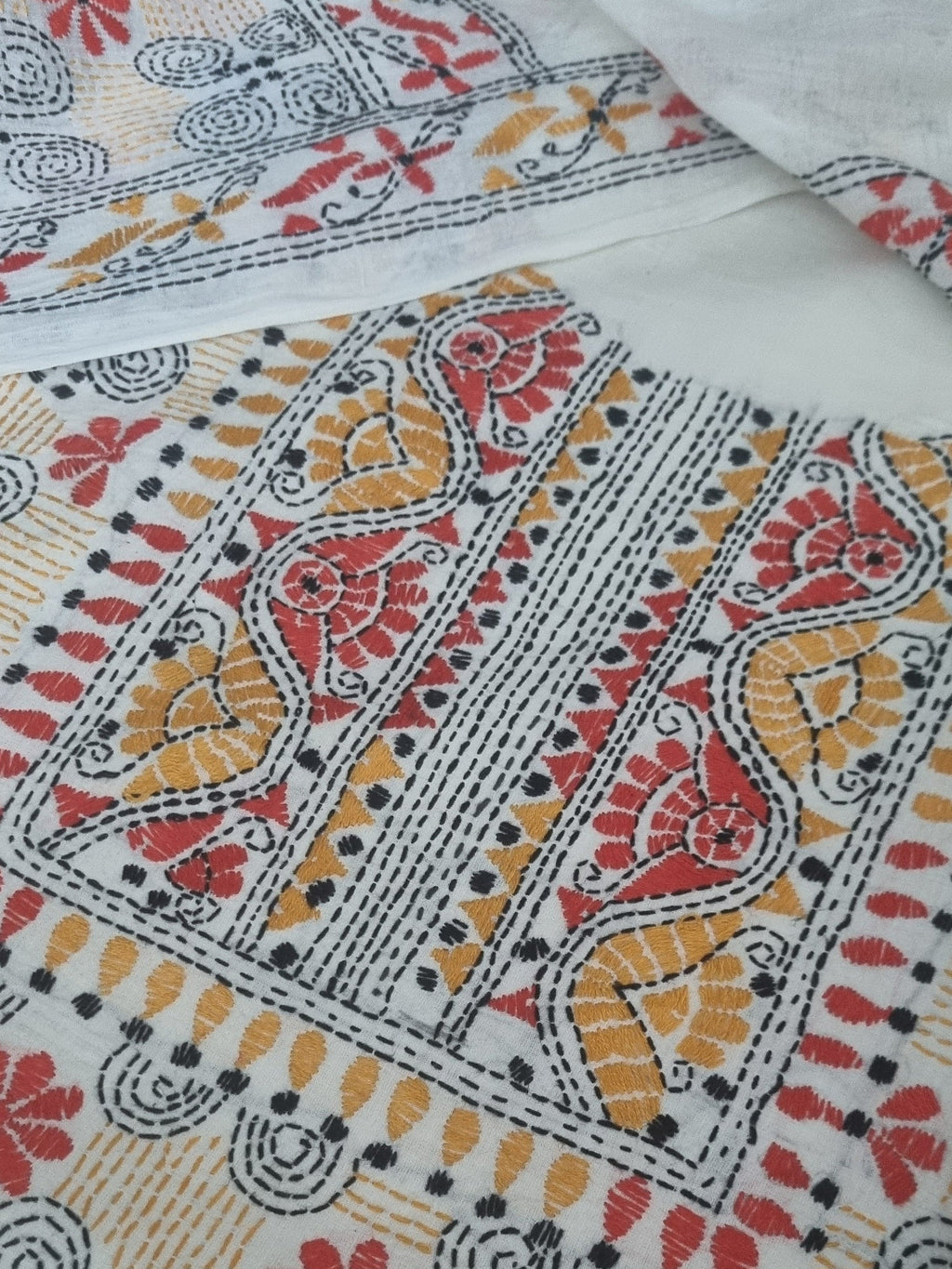 Cream cotton kurta with multicolour Kantha embroidery – editorial portrait view