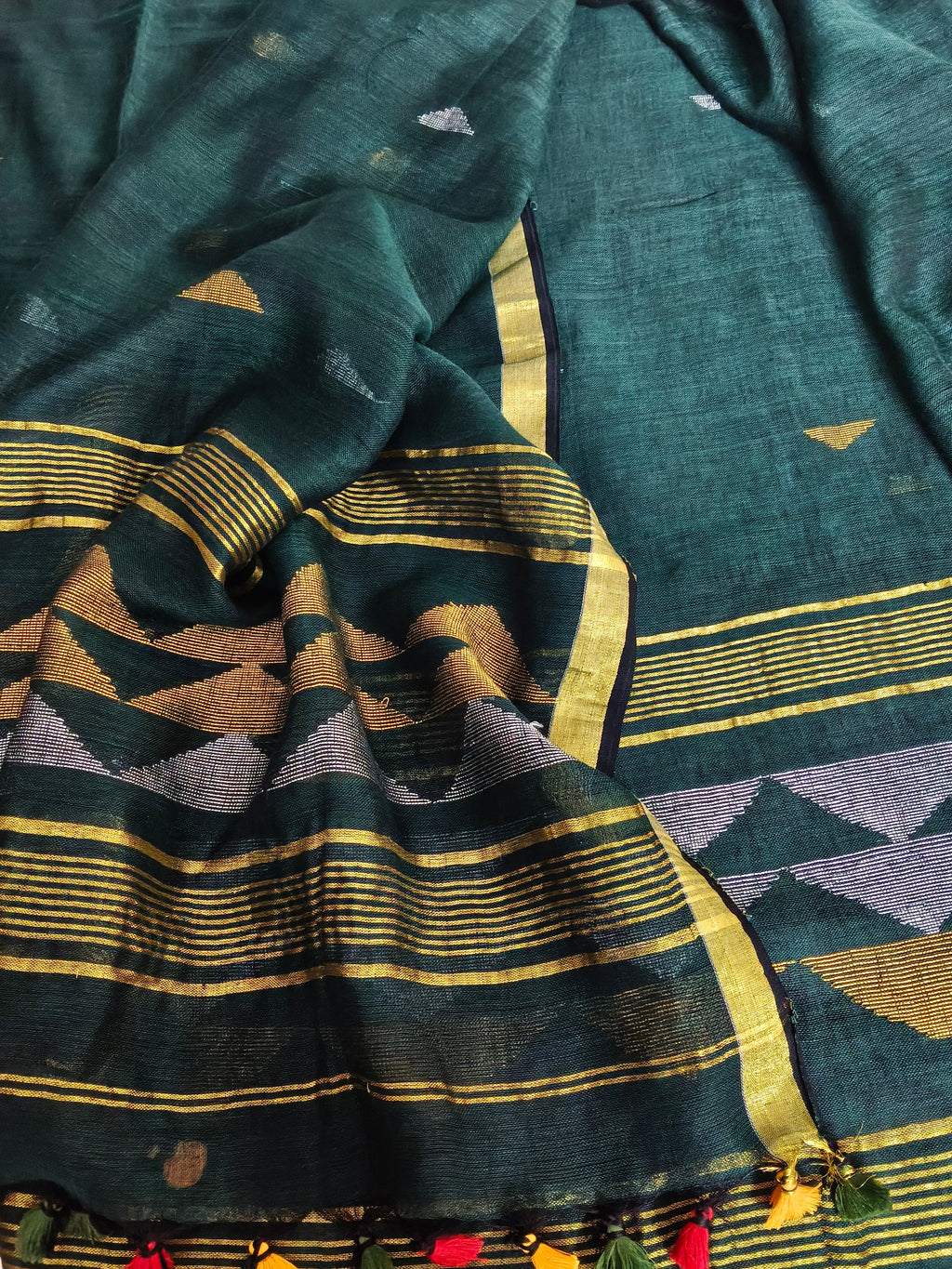 60 Lea linen unstitched suit material in deep green – close-up of inverted triangle motifs, pure Indian handloom