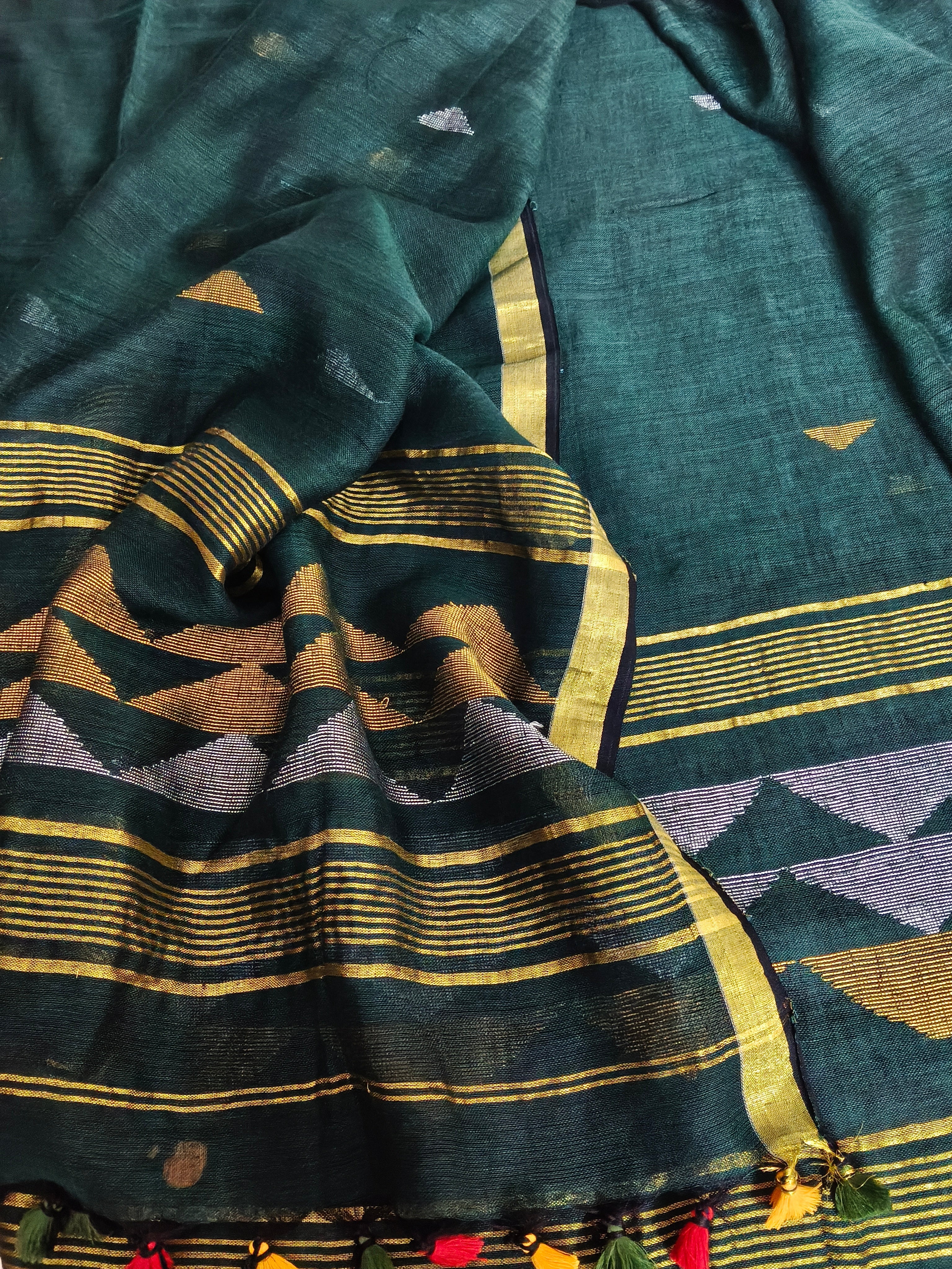 60 Lea linen unstitched suit material in deep green – close-up of inverted triangle motifs, pure Indian handloom