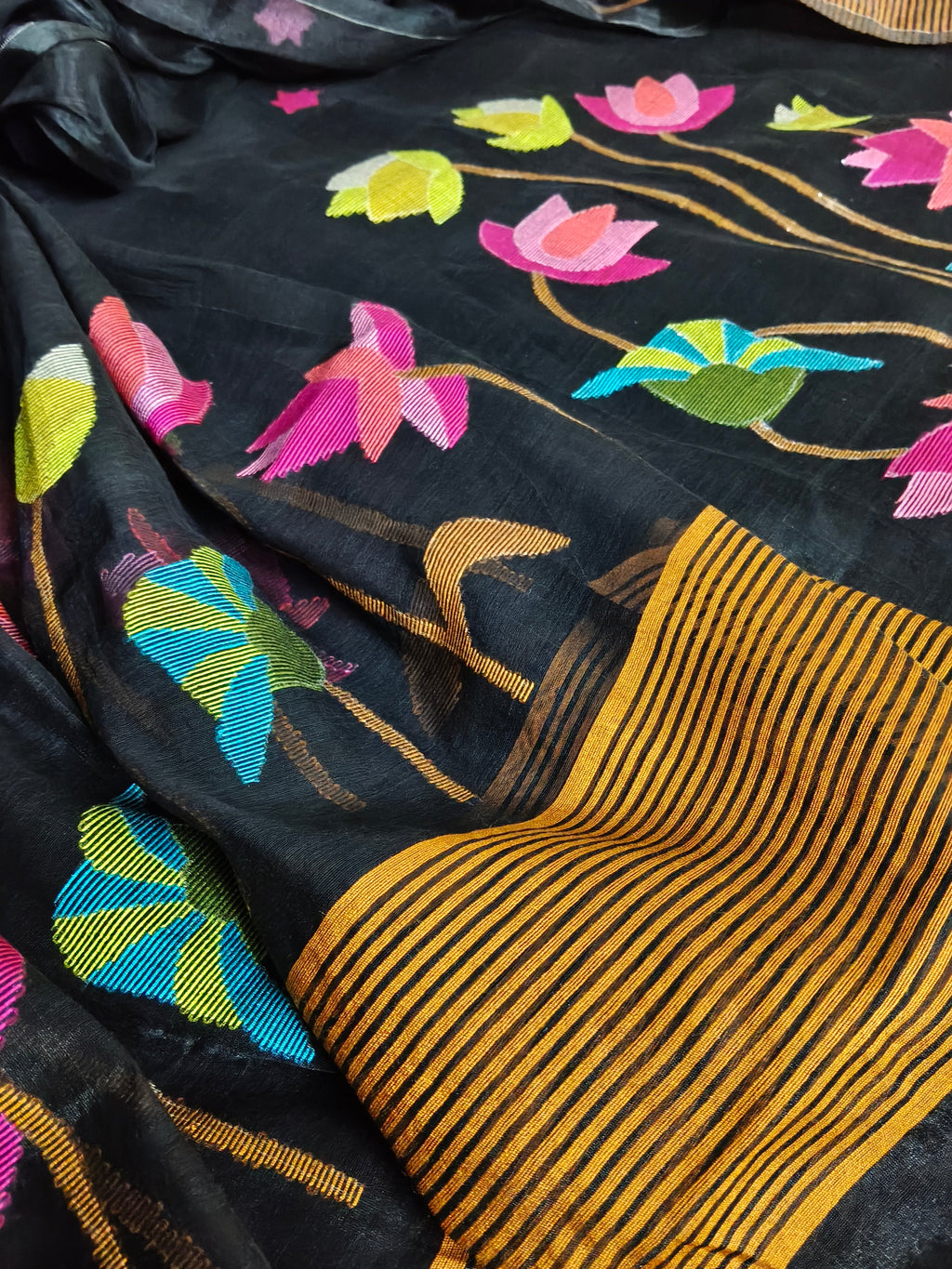 Bengal Jamdani suit fabric detail – midnight black with intricate multicolor woven star motifs, Indian handloom