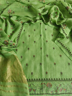 Green handloom Cotton Mal suit fabric with machine embroidery – flat lay