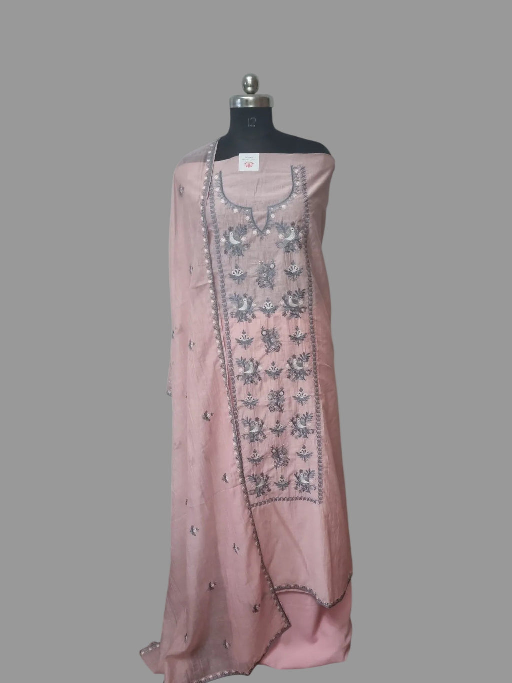 Powder pink Chanderi Silk unstitched suit set with machine embroidery – styled view