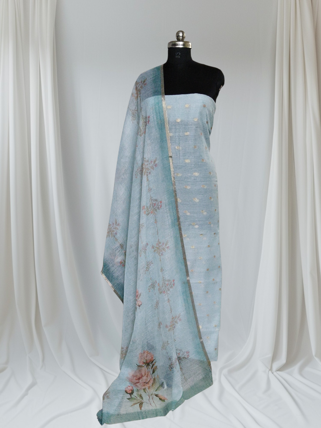 Styled portrait of green Kota Doria 2-piece unstitched suit – Banarasi booti & digital print dupatta