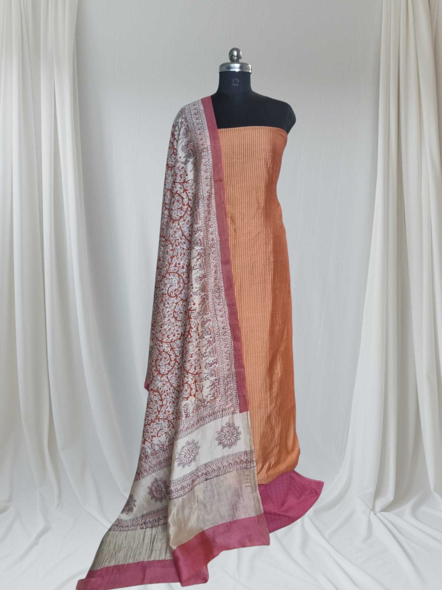 Orange and beige handloom Maheshwari silk unstitched suit – editorial portrait