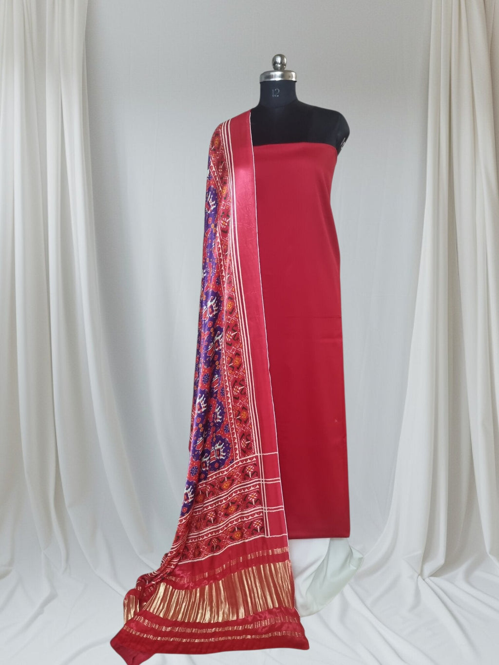 Red off white Gajji silk Patola dupatta with cotton silk unstitched suit set – editorial portrait