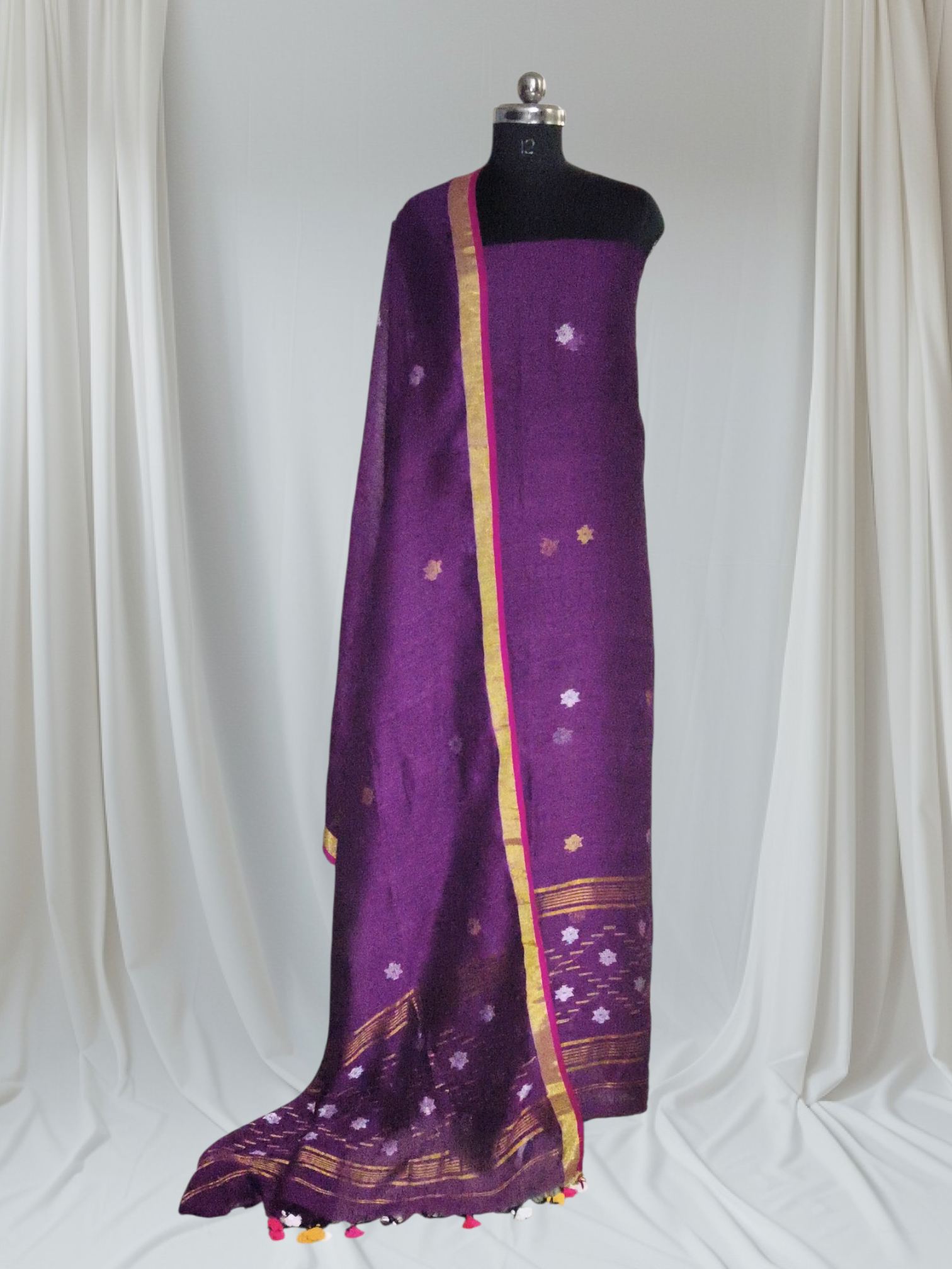 Deep purple Jamdani linen 2-pc unstitched suit flat lay – handwoven silver and gold metallic stars and daman border