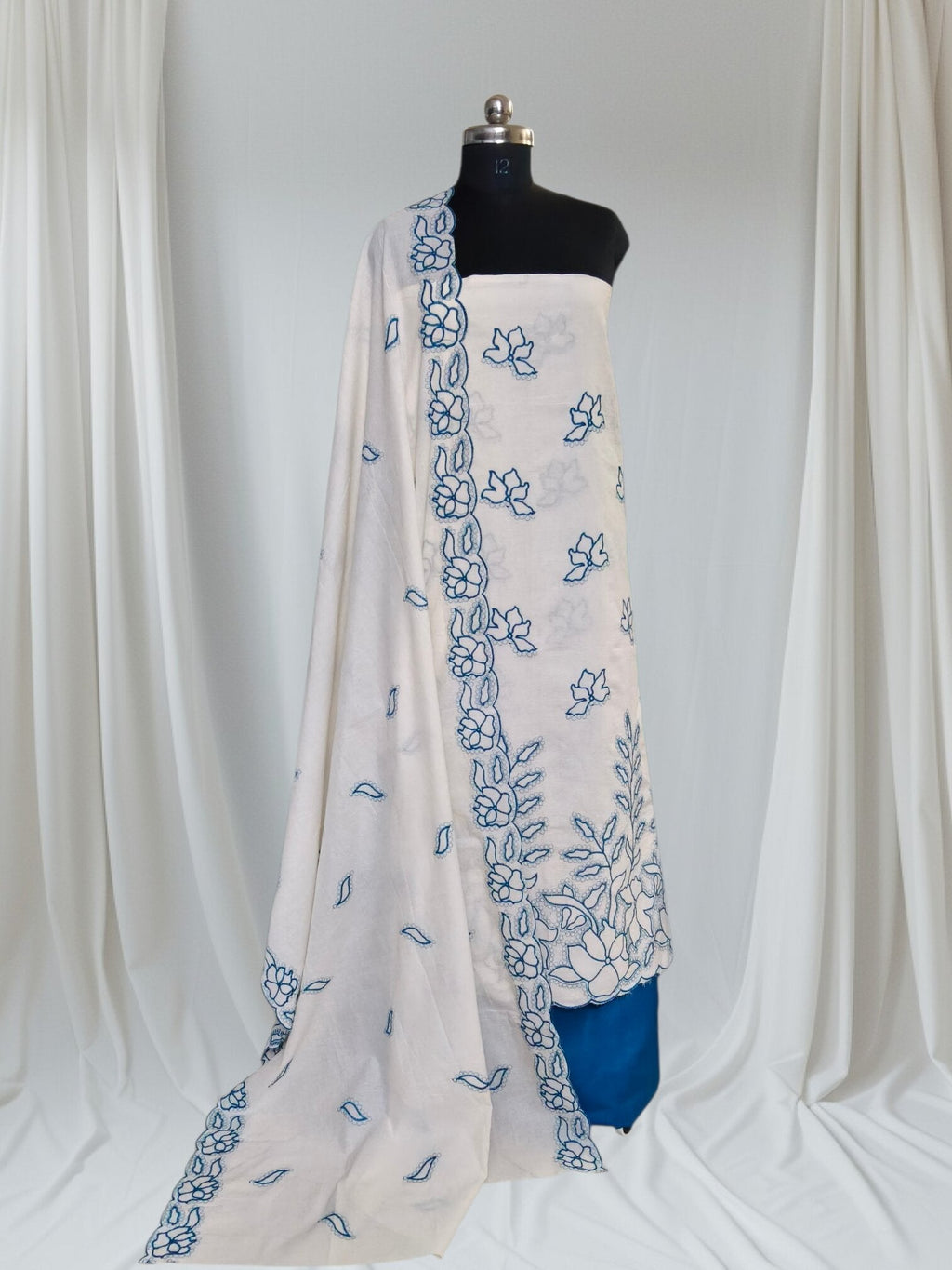 Styled flat lay of cream blue scalloped unstitched suit with embroidered cotton dupatta – SKU 1076