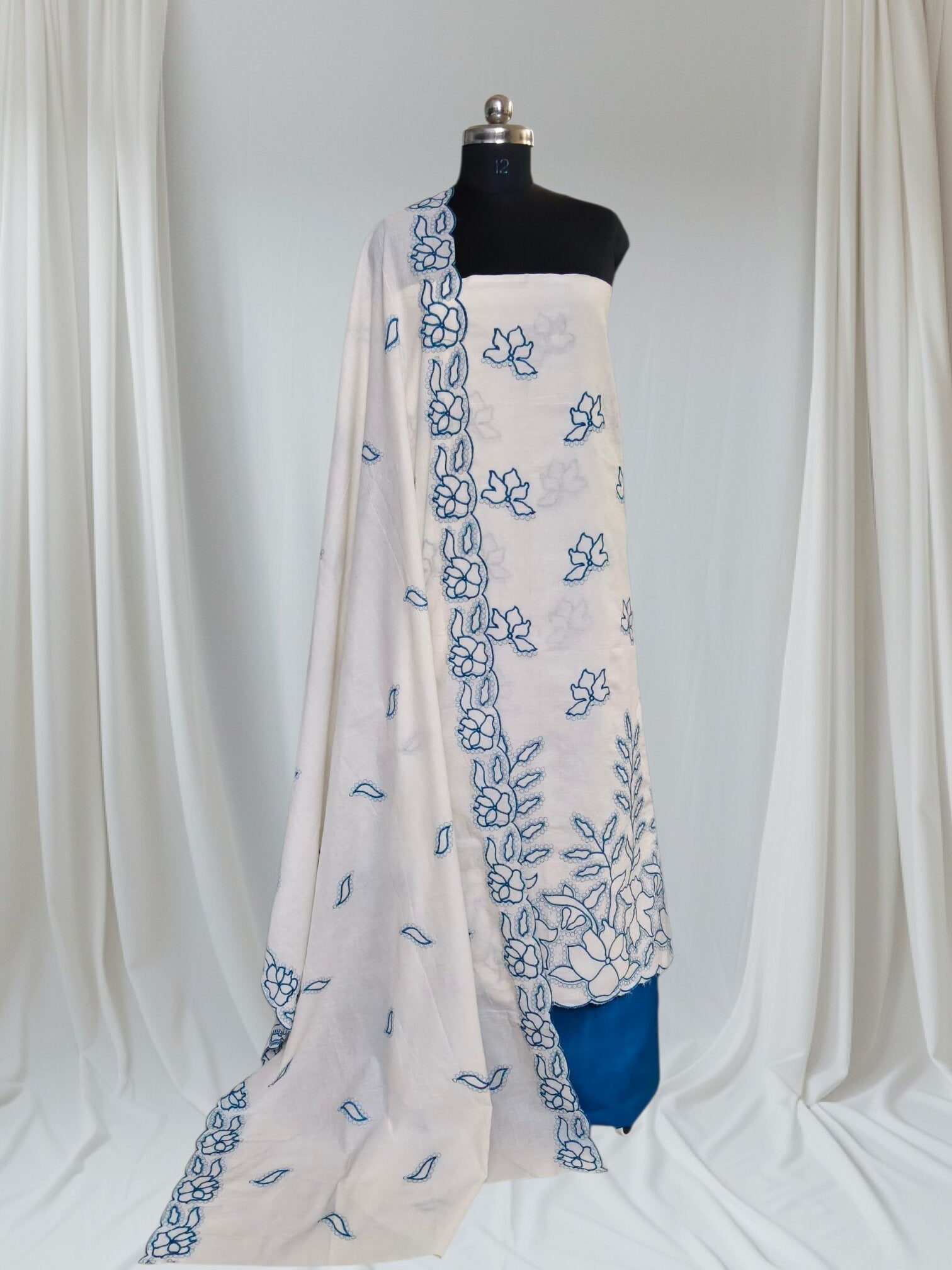 Styled flat lay of cream blue scalloped unstitched suit with embroidered cotton dupatta – SKU 1076