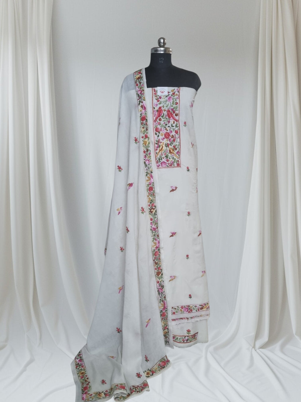 Red bird Parsi Gara hand-embroidered cotton suit set – editorial portrait styling