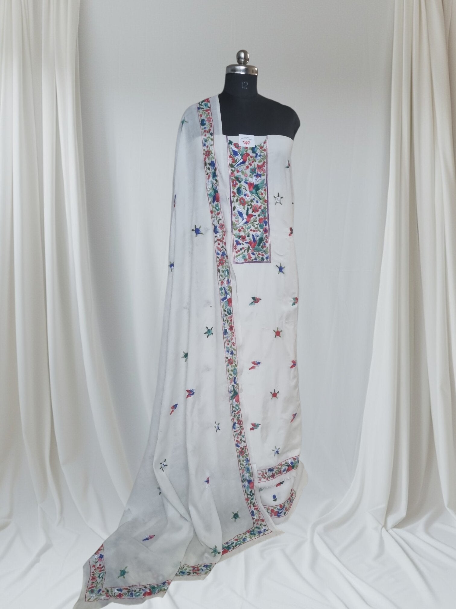 Cream green blue bird Parsi Gara hand-embroidered cotton suit set – editorial portrait styling