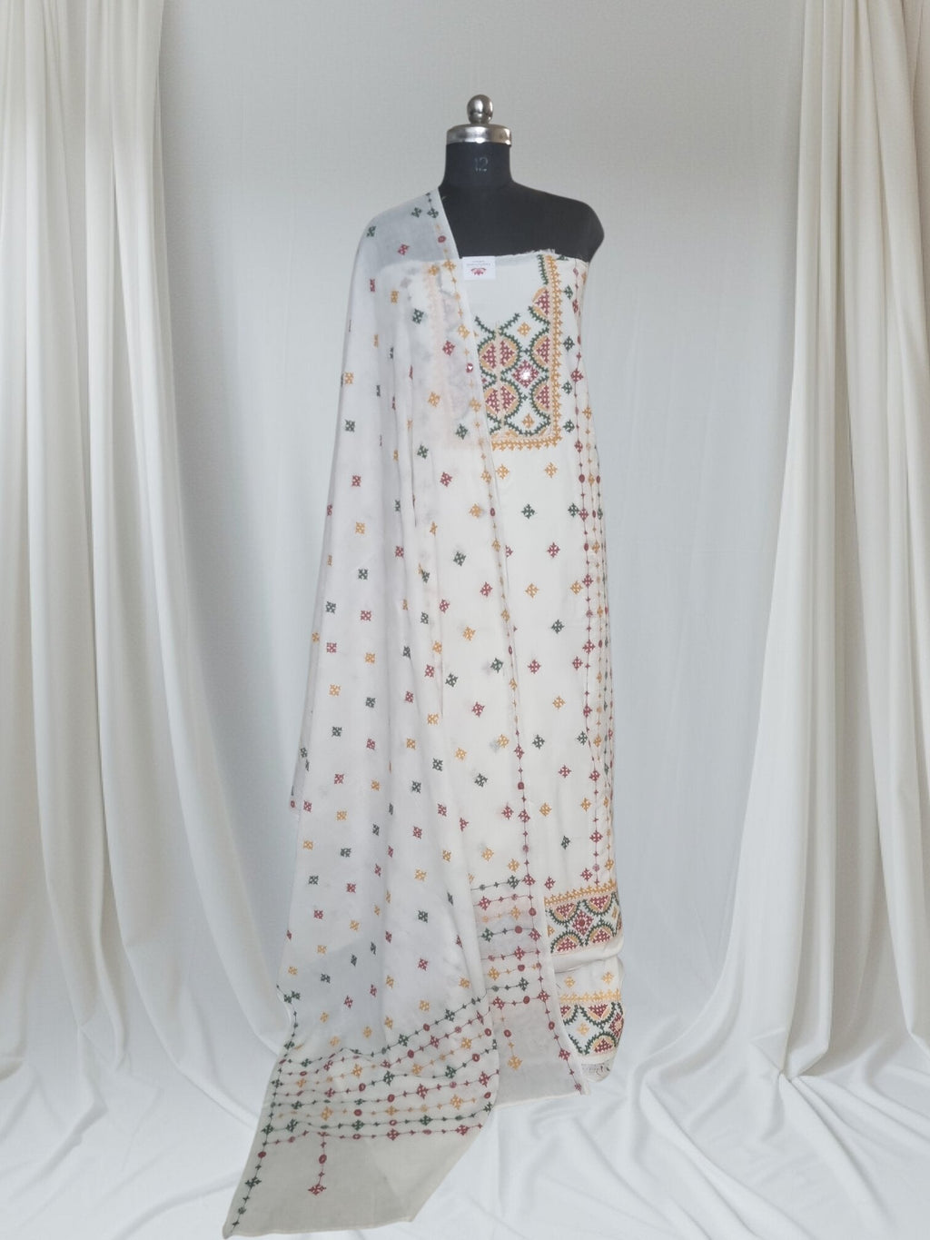 Multicolour Sindhi hand-embroidered cotton suit set – editorial portrait styling