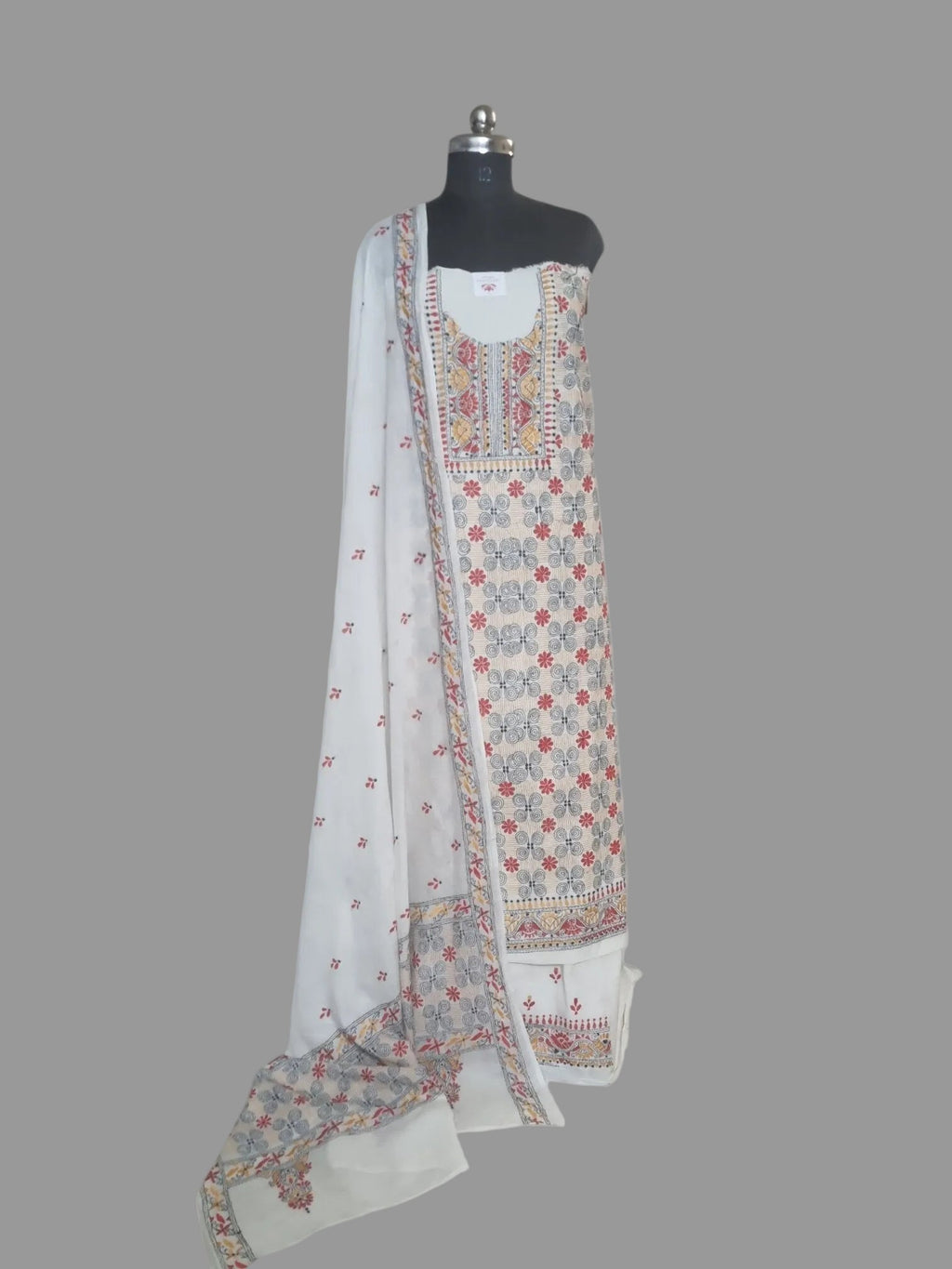 fully adorned with multicolour Kantha patterns on breathable cream cotton.