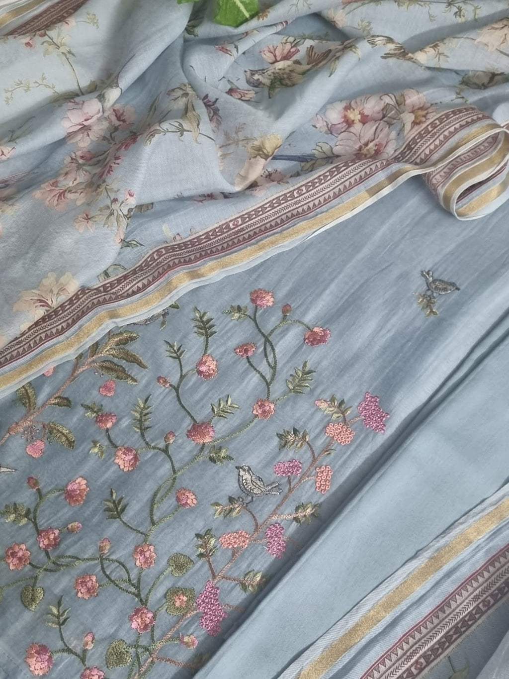 Powder blue machine embroidery unstitched suit set – front flat lay