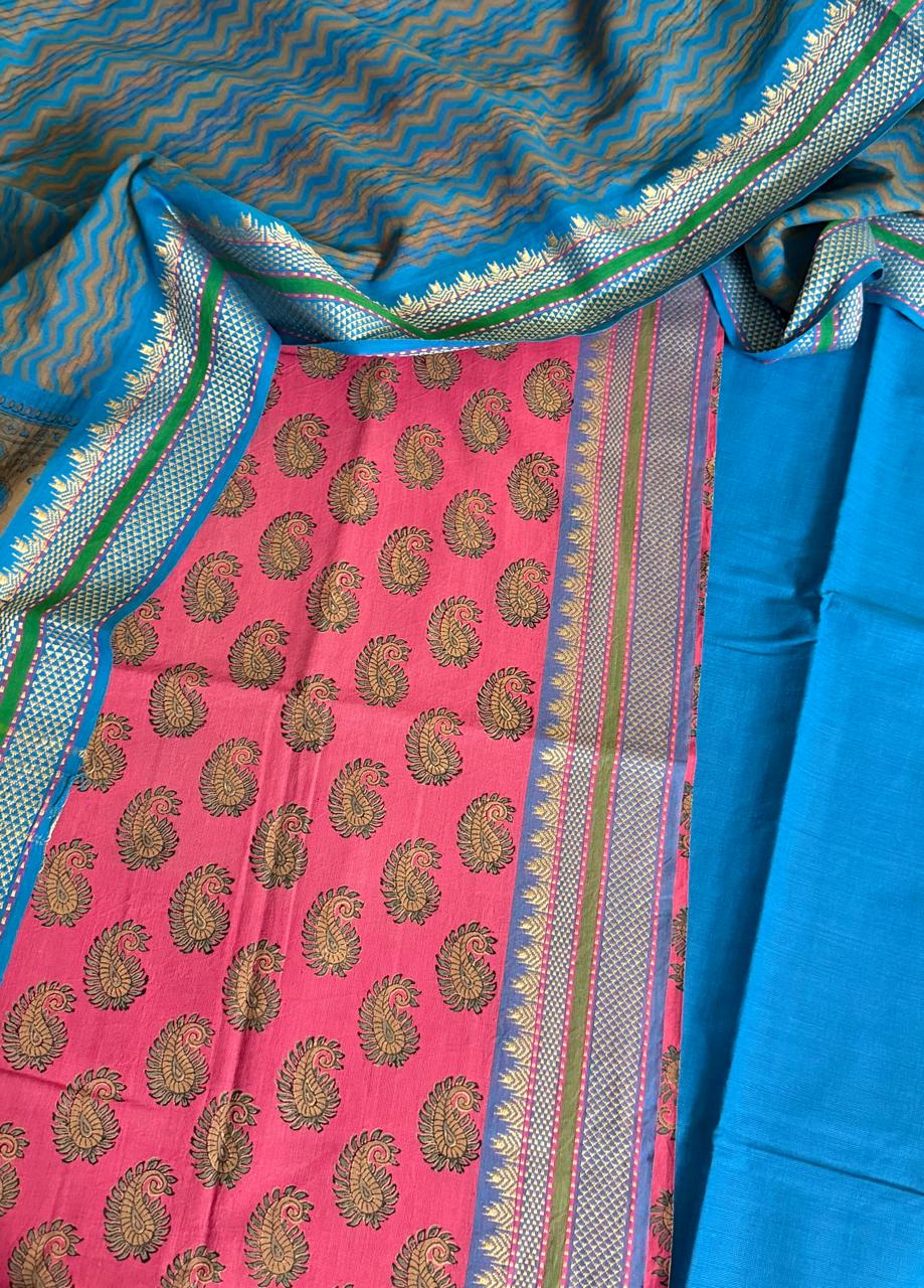 Close-up flat lay of pink handloom cotton kurta fabric with gold woven paisley butis, woven temple border, blue bottom fabric, and blue dupatta with zigzag weave