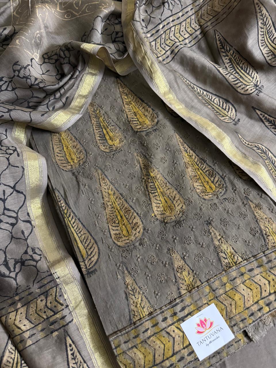 Khaki Ajrakh cotton hakoba kurta fabric with gold paisley embroidery and Chanderi silk dupatta with zari border, flat lay detail