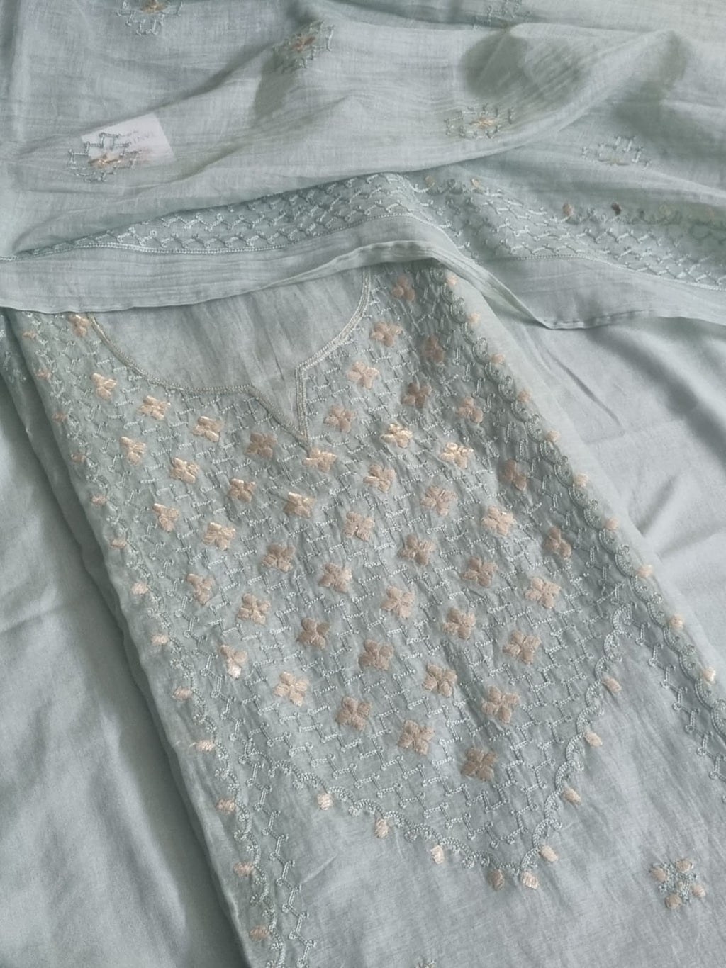 Powder green Chanderi silk unstitched kurta fabric with pita work embroidery and floral motifs, flat lay with dupatta