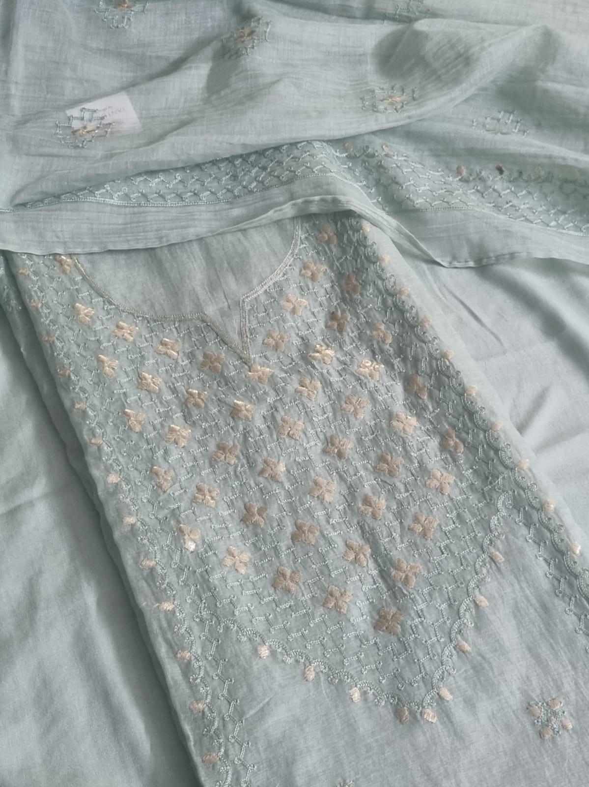 Powder green Chanderi silk unstitched kurta fabric with pita work embroidery and floral motifs, flat lay with dupatta