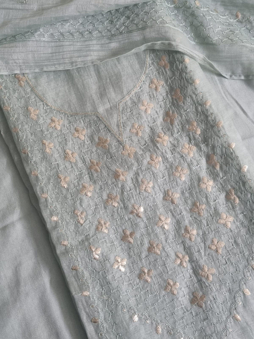 Powder green Chanderi silk unstitched kurta fabric with scattered pita work floral embroidery and silver thread jaal, flat lay detail