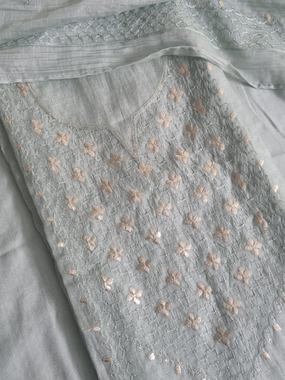 Powder green Chanderi silk unstitched kurta fabric with scattered pita work floral embroidery and silver thread jaal, flat lay detail