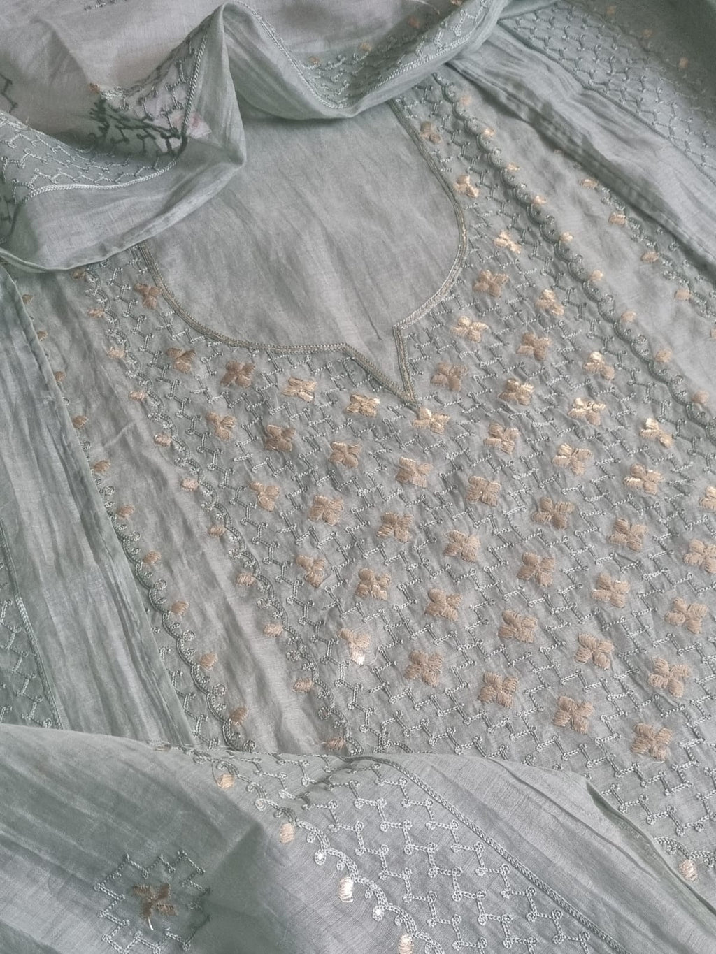 Close-up of powder green Chanderi silk kurta neckline with pita work embroidery, floral motifs, and silver thread jaal pattern