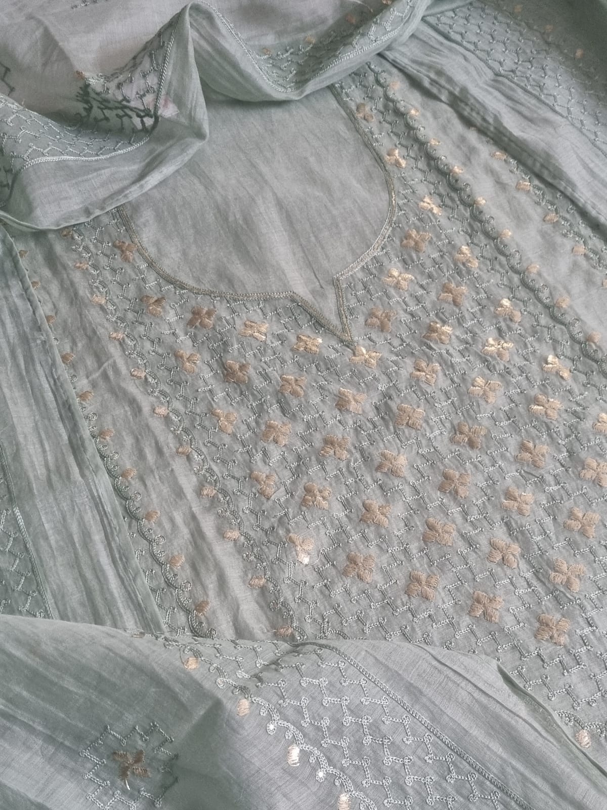 Close-up of powder green Chanderi silk kurta neckline with pita work embroidery, floral motifs, and silver thread jaal pattern