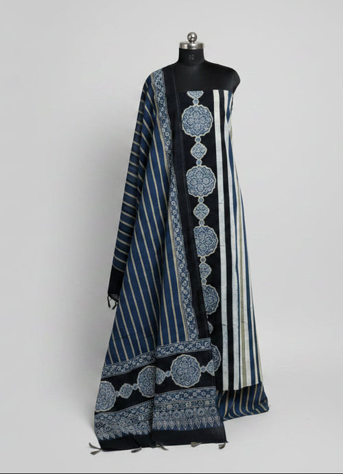 Blue and black Ajrakh cotton 3-piece unstitched suit set on mannequin — black kurta with white stripes and blue medallion block print, striped blue dupatta with Ajrakh border and tassels