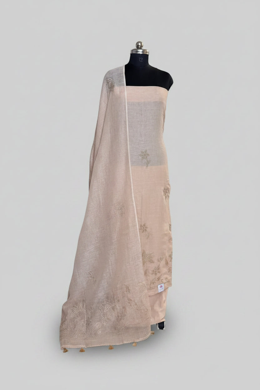 Beige linen 3-piece unstitched suit set displayed on mannequin with embroidered dupatta draped over shoulder