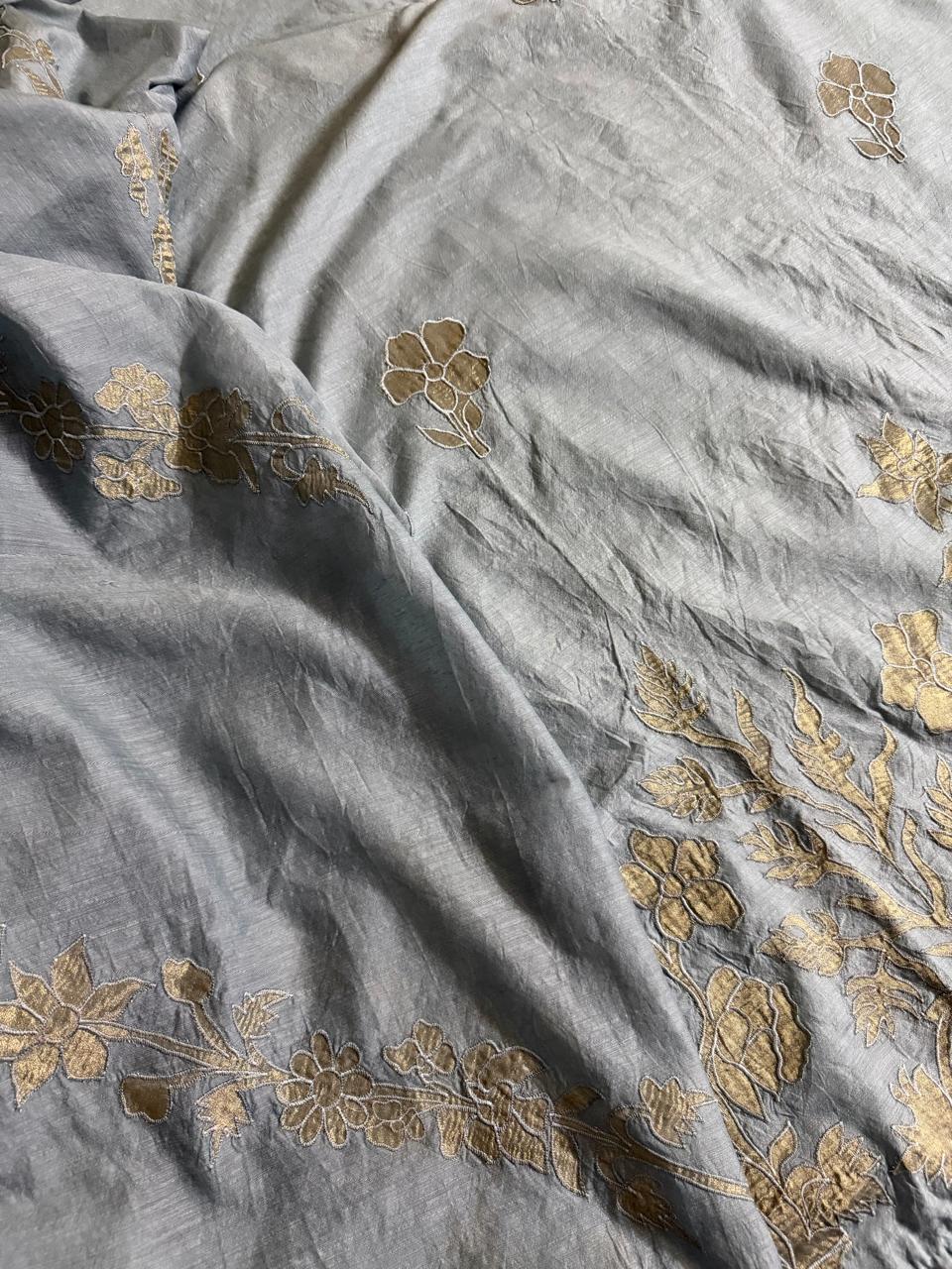 Grey Chanderi silk unstitched suit fabric with gold appliqué small floral and leaf motifs scattered across the surface
